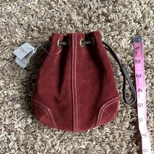 New with tags maroon coach wristlet.